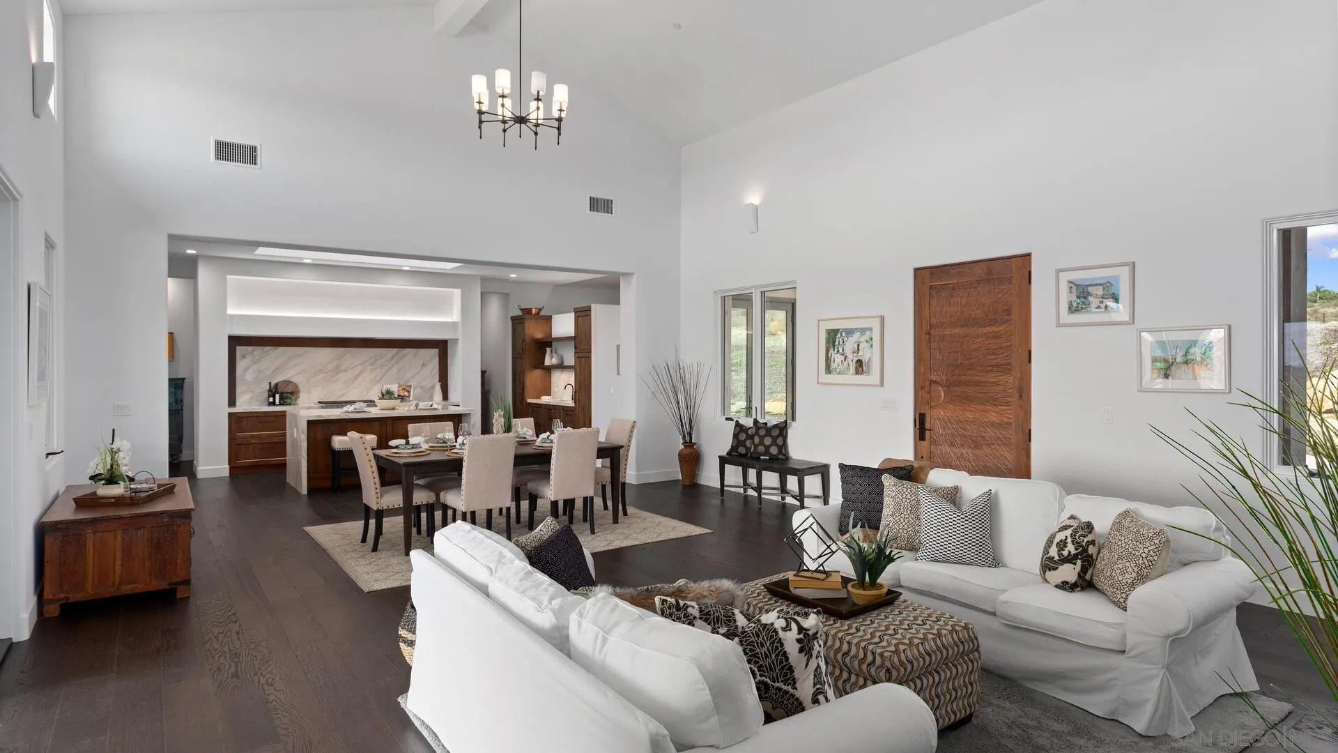 16674 Liberty Ridge San Diego, CA 92127 - Photo 10 of 35 a living room with furniture wooden floor and a chandelier