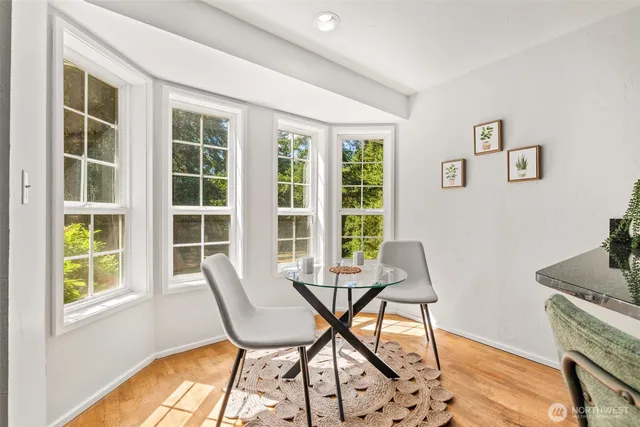 a workspace room with furniture and a window