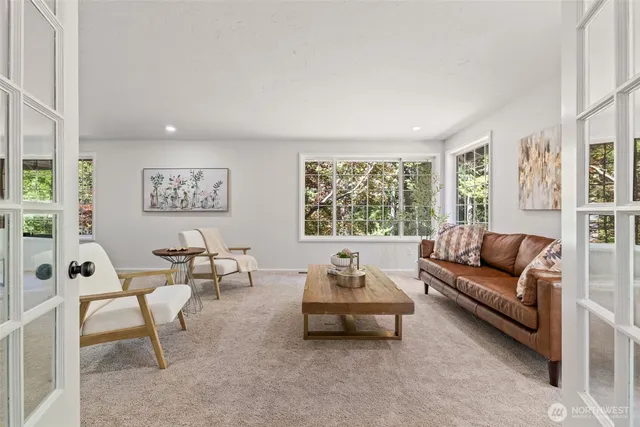 a living room with furniture and a large window