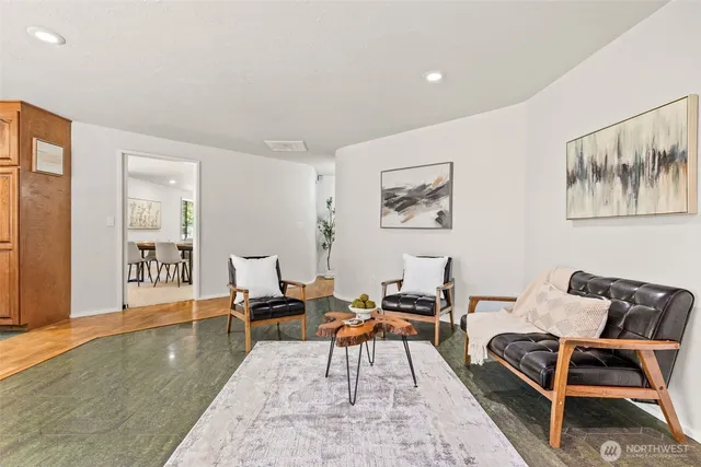 a living room with furniture and a rug