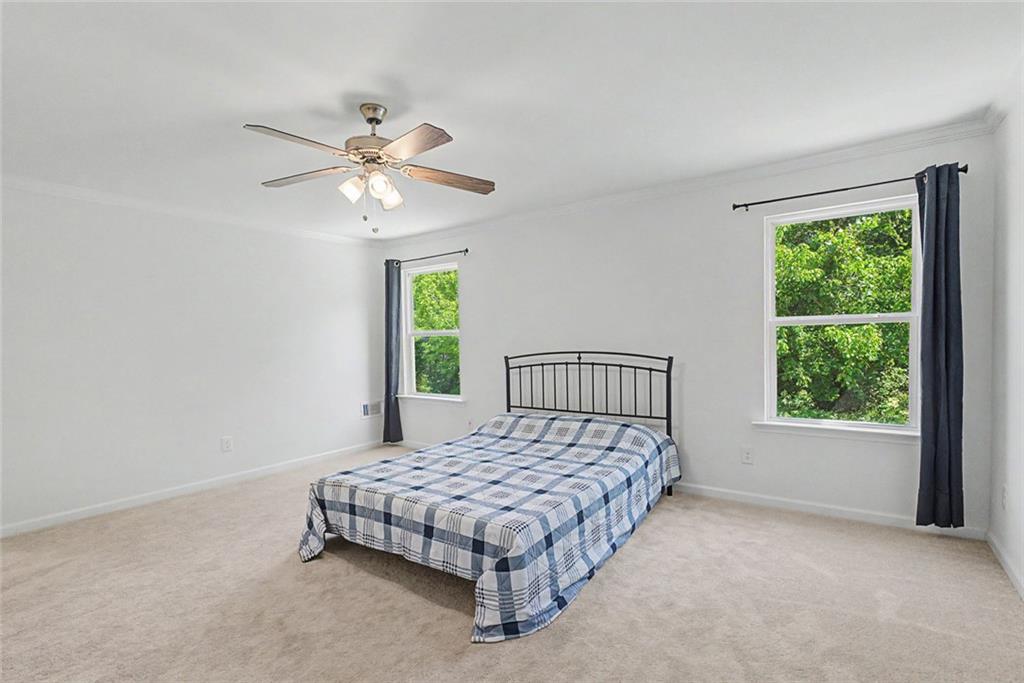2310 Portrush Way Southeast Atlanta, GA 30339 - Photo 25 of 38 a bedroom with a bed and window