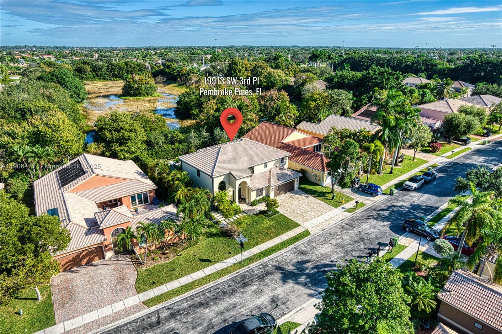 19913 Southwest 3rd Place Pembroke Pines, FL 33029 - Photo 12 of 56 an aerial view of a house with a garden and mountain view in back