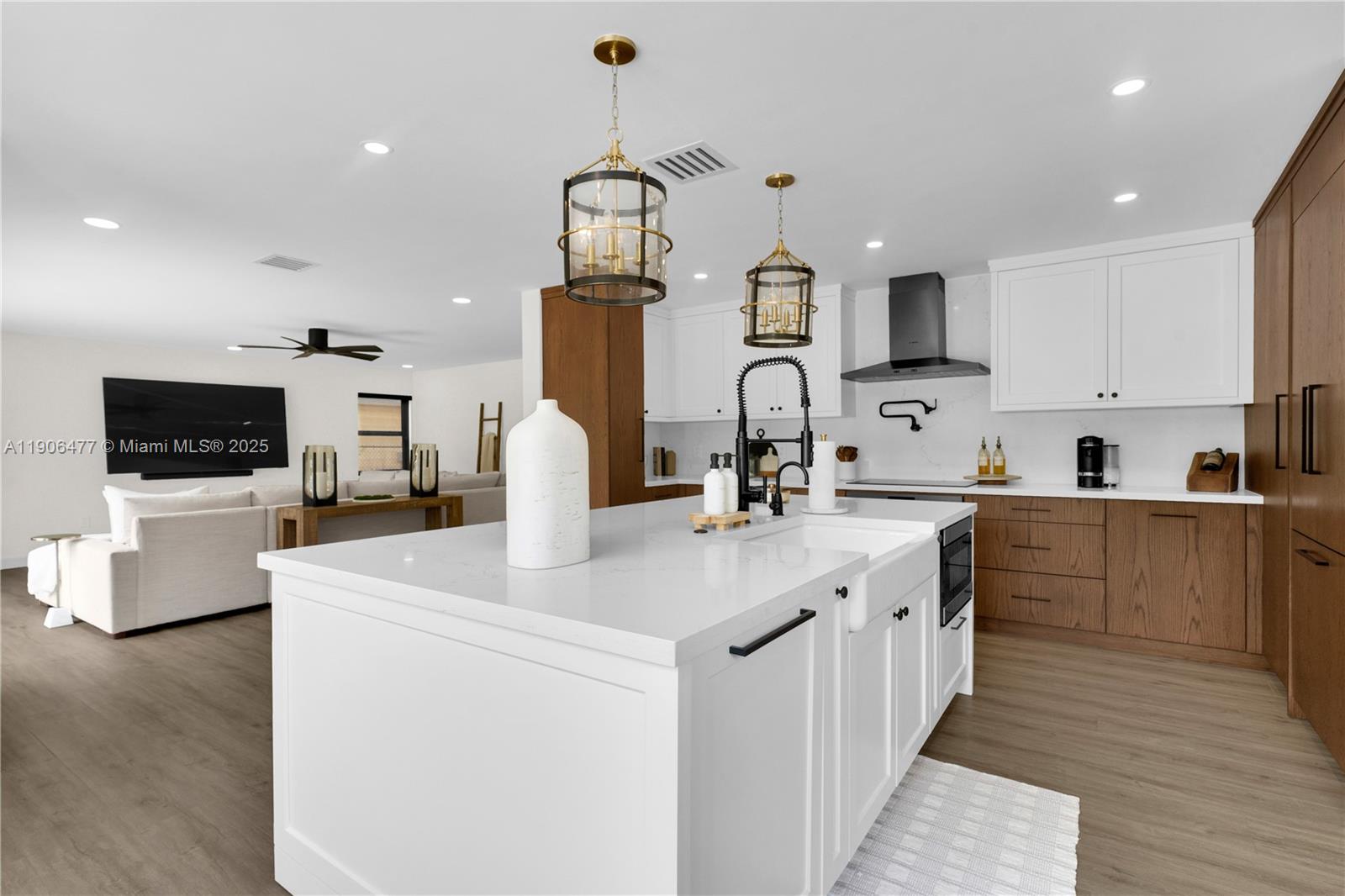 19913 Southwest 3rd Place Pembroke Pines, FL 33029 - Photo 23 of 56 a kitchen with stainless steel appliances kitchen island a sink a stove and cabinets