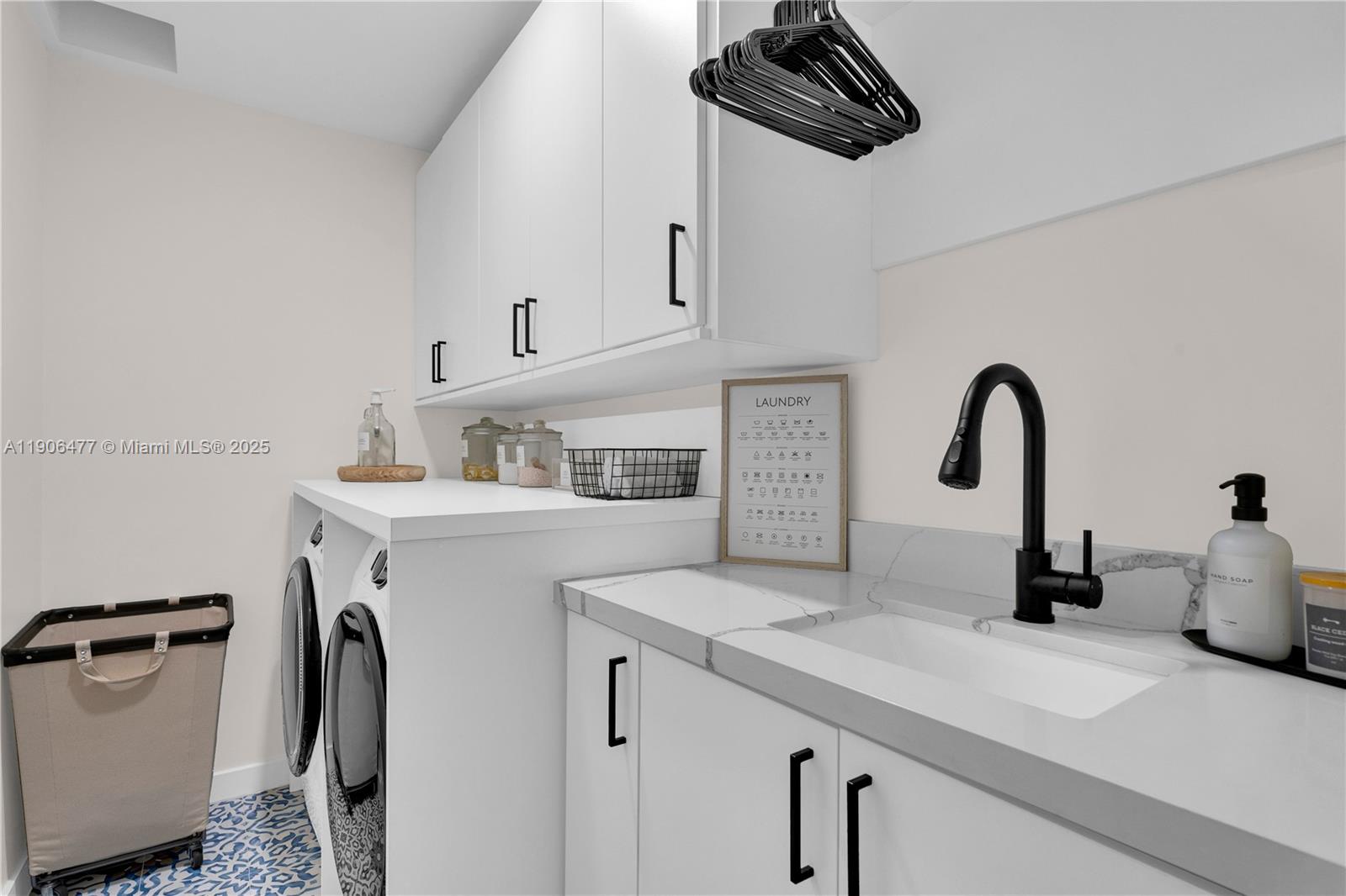 19913 Southwest 3rd Place Pembroke Pines, FL 33029 - Photo 29 of 56 a kitchen with a sink a refrigerator and cabinets