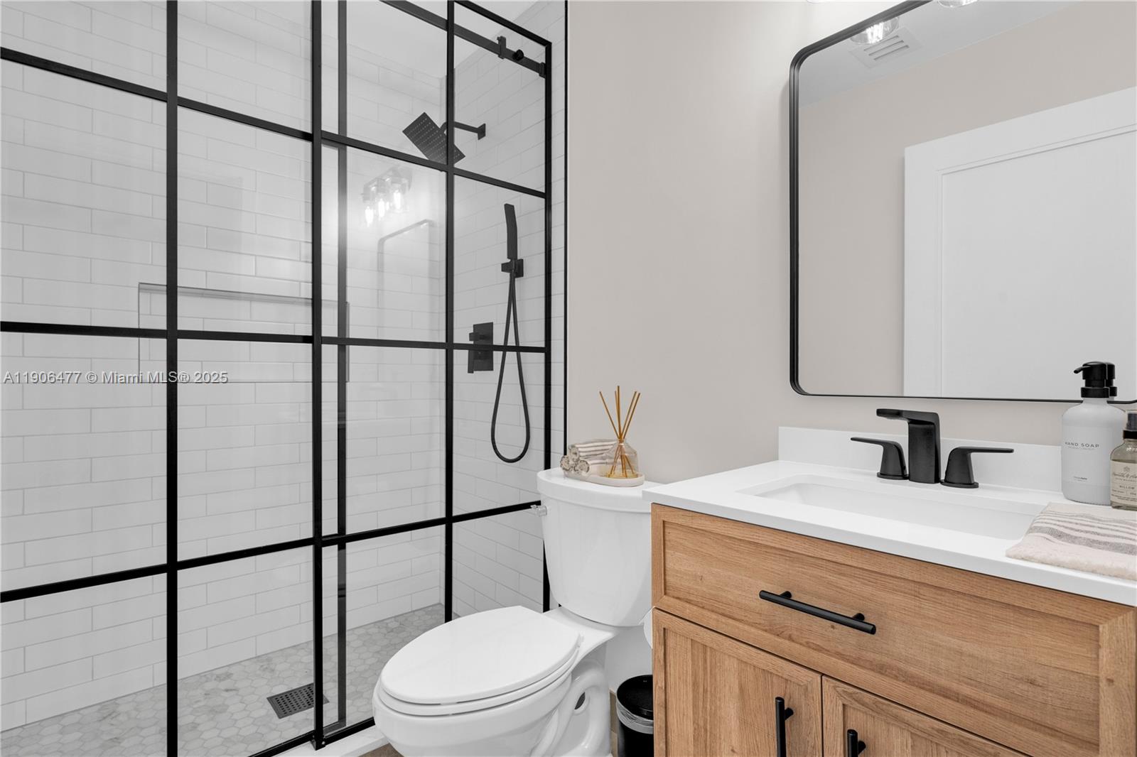 19913 Southwest 3rd Place Pembroke Pines, FL 33029 - Photo 30 of 56 a bathroom with a toilet sink vanity and mirror