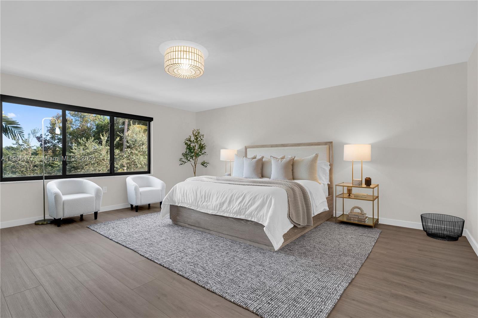 19913 Southwest 3rd Place Pembroke Pines, FL 33029 - Photo 33 of 56 a bedroom with a large bed and a large window