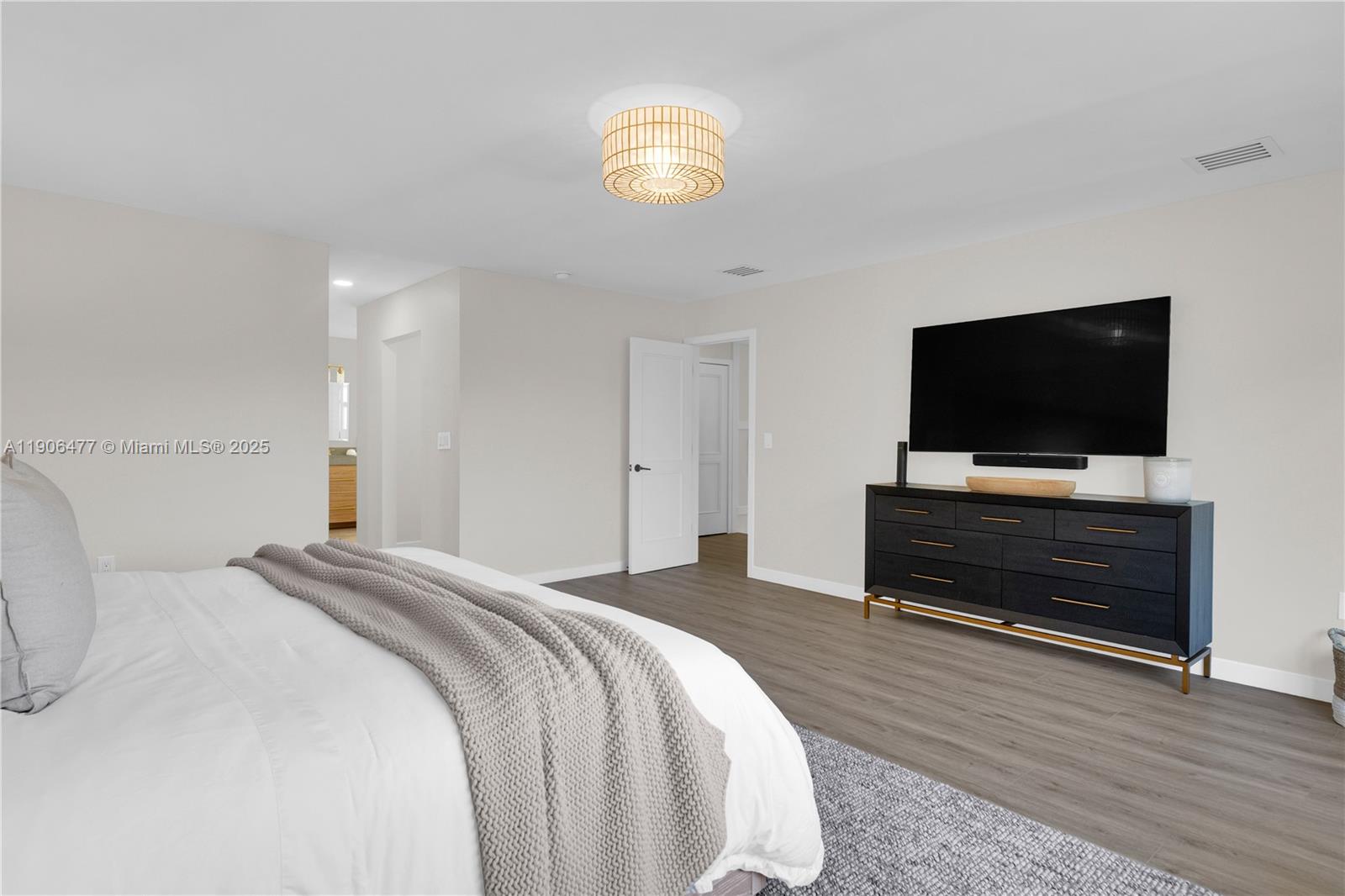 19913 Southwest 3rd Place Pembroke Pines, FL 33029 - Photo 34 of 56 a bedroom with a bed and a flat screen tv