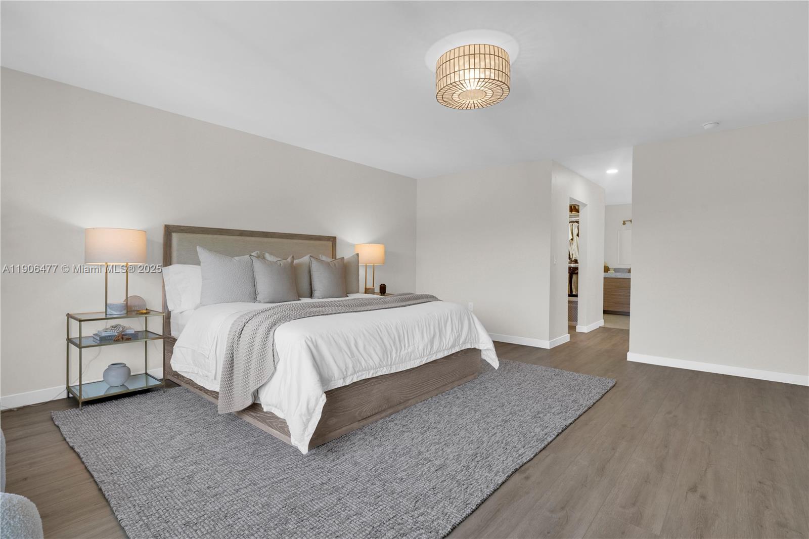 19913 Southwest 3rd Place Pembroke Pines, FL 33029 - Photo 35 of 56 a bedroom with a bed and a chandelier