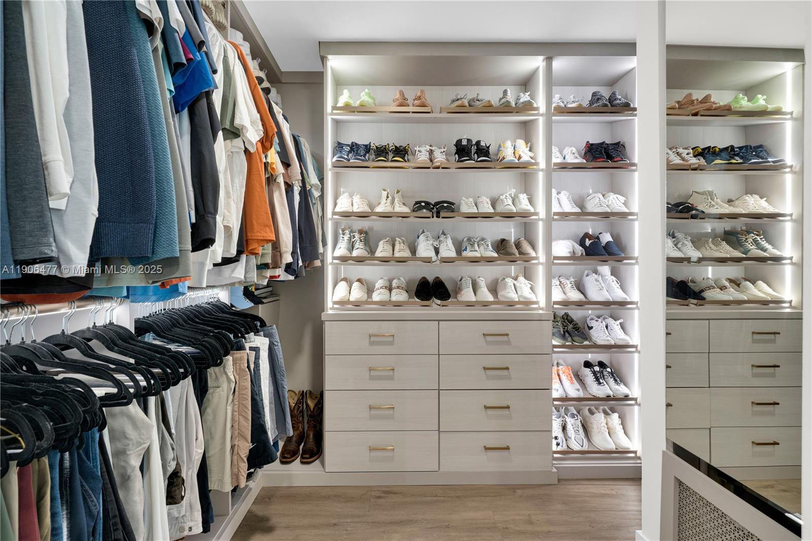 19913 Southwest 3rd Place Pembroke Pines, FL 33029 - Photo 39 of 56 a view of walk in closet with clothes and shoes