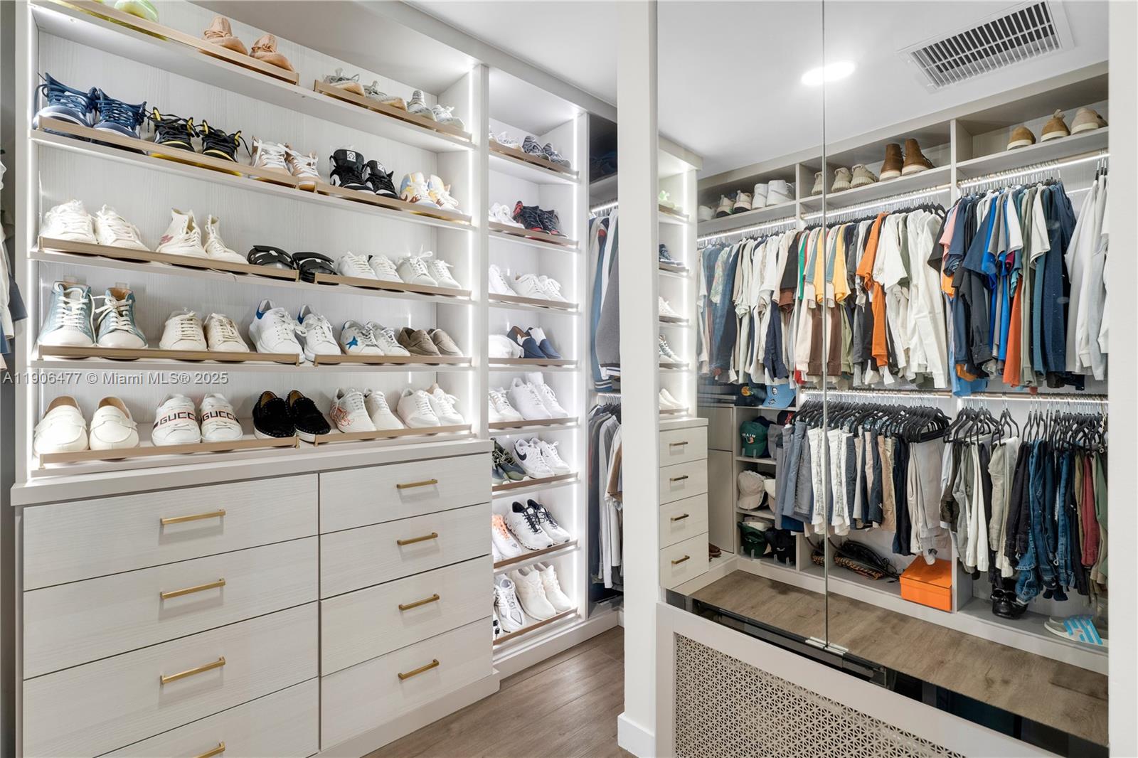 19913 Southwest 3rd Place Pembroke Pines, FL 33029 - Photo 40 of 56 a view of walk in closet with clothes and shoes