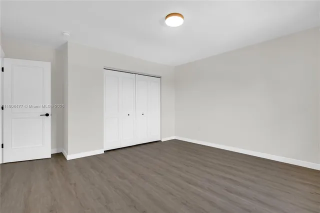 a view of a house with swimming pool and sitting area