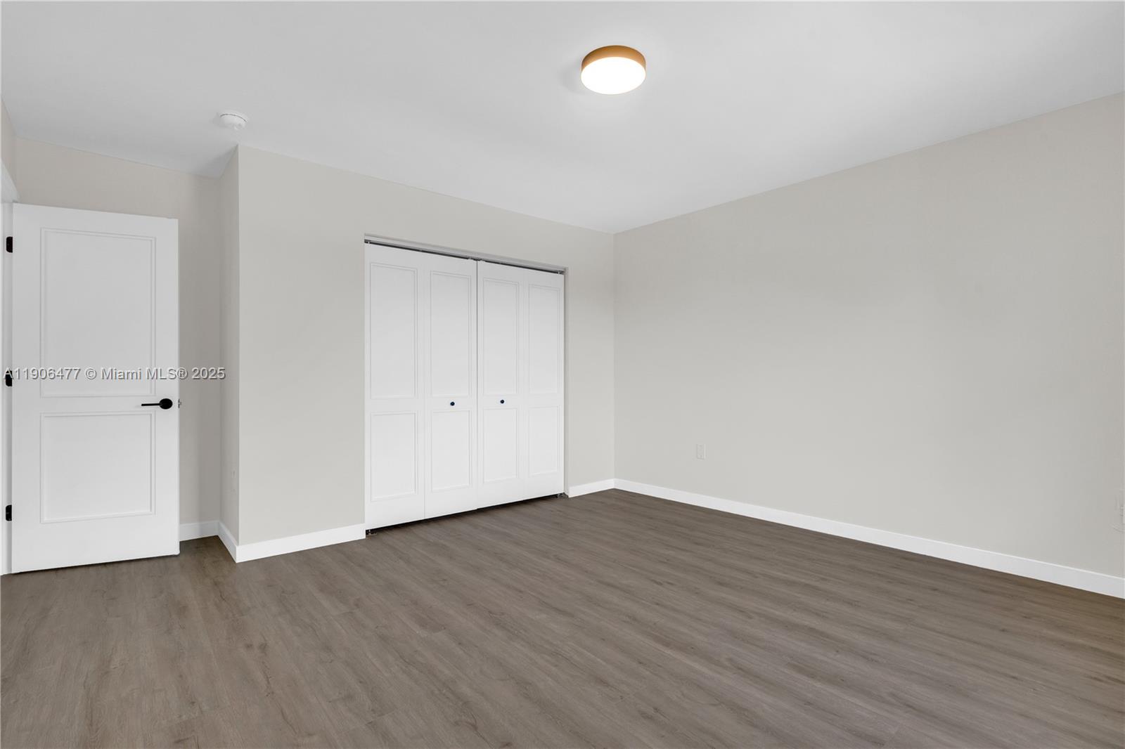 19913 Southwest 3rd Place Pembroke Pines, FL 33029 - Photo 44 of 56 a view of an empty room with wooden floor