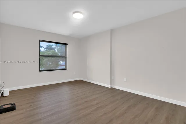 a view of a garden with an outdoor seating