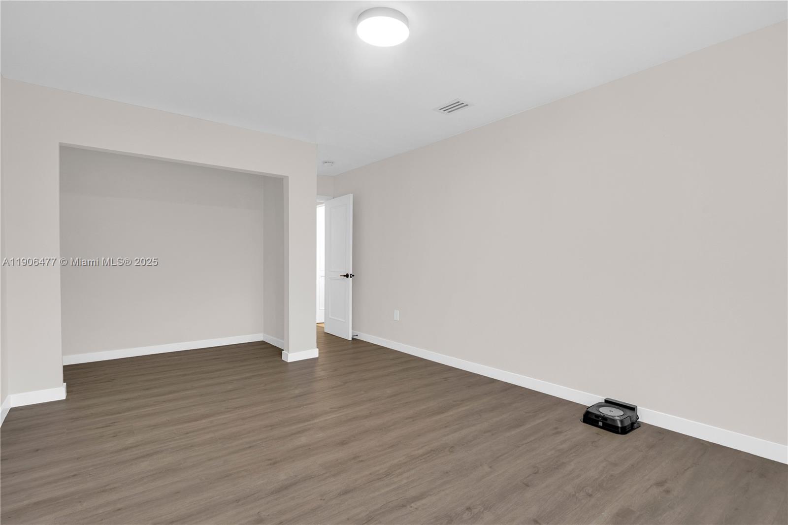 19913 Southwest 3rd Place Pembroke Pines, FL 33029 - Photo 47 of 56 a view of an empty room with wooden floor