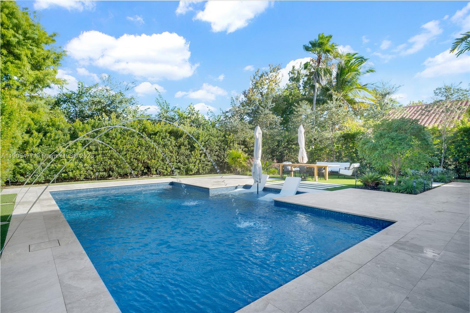 19913 Southwest 3rd Place Pembroke Pines, FL 33029 - Photo 50 of 56 a view of a swimming pool with an outdoor space