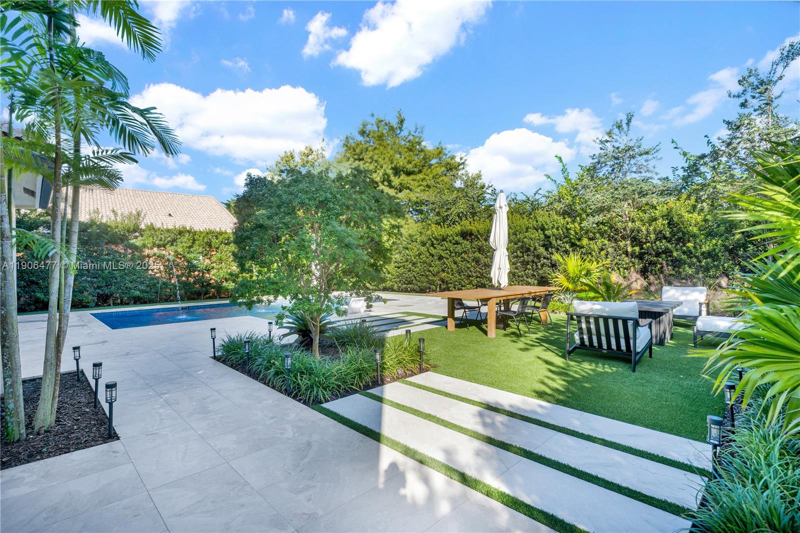 19913 Southwest 3rd Place Pembroke Pines, FL 33029 - Photo 51 of 56 a view of a garden with an outdoor seating