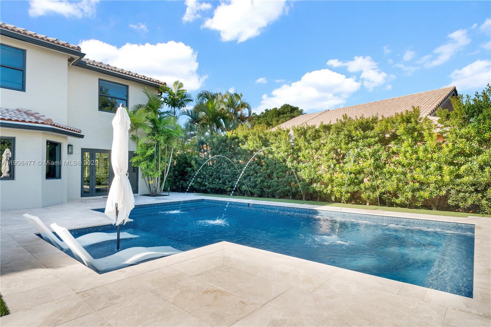 19913 Southwest 3rd Place Pembroke Pines, FL 33029 - Photo 52 of 56 a view of a swimming pool with some potted plants
