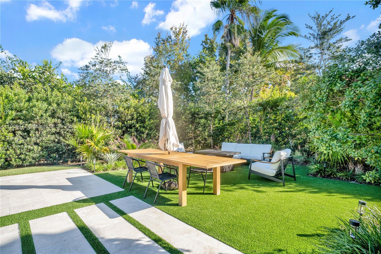 19913 Southwest 3rd Place Pembroke Pines, FL 33029 - Photo 54 of 56 a view of a patio with table and chairs and potted plants