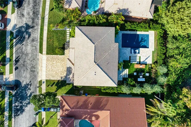 an aerial view of house with yard