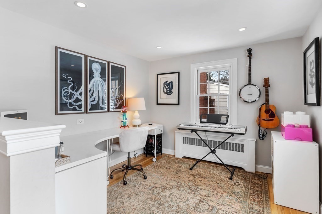 91 Valley Road Milton, MA 02186 - Photo 15 of 29 a living room with furniture a rug and white walls