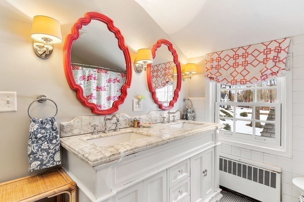 91 Valley Road Milton, MA 02186 - Photo 24 of 29 a bathroom with a granite countertop double vanity and a mirror