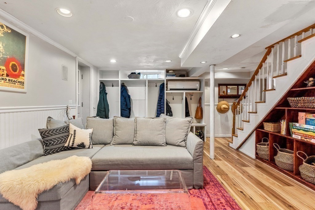 91 Valley Road Milton, MA 02186 - Photo 26 of 29 a living room with furniture or stairs and a rug