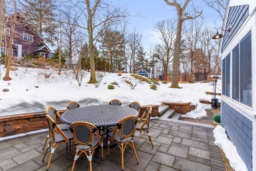 91 Valley Road Milton, MA 02186 - Photo 28 of 29 a view of a backyard with table and chairs