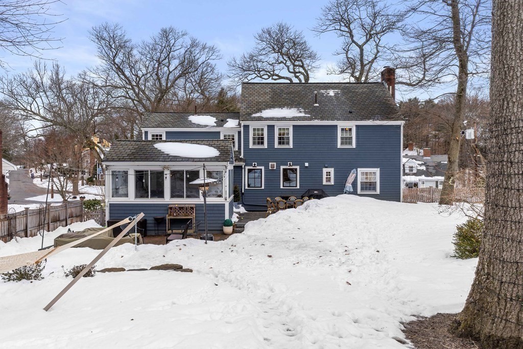 91 Valley Road Milton, MA 02186 - Photo 29 of 29 a front view of a house with a yard covered in snow