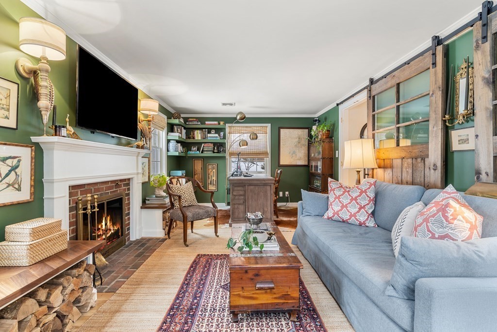 91 Valley Road Milton, MA 02186 - Photo 4 of 29 a living room with furniture fireplace and flat screen tv