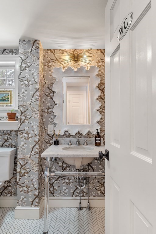 91 Valley Road Milton, MA 02186 - Photo 7 of 29 a bathroom with a sink and a mirror