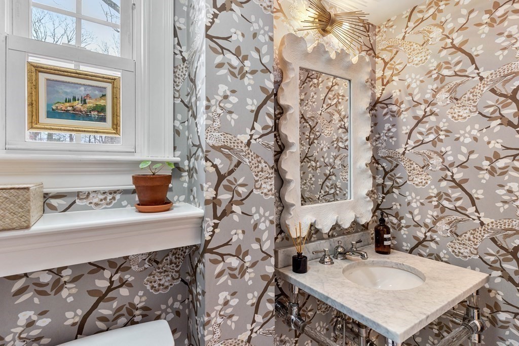 91 Valley Road Milton, MA 02186 - Photo 8 of 29 a bathroom with a sink and a mirror with painted walls