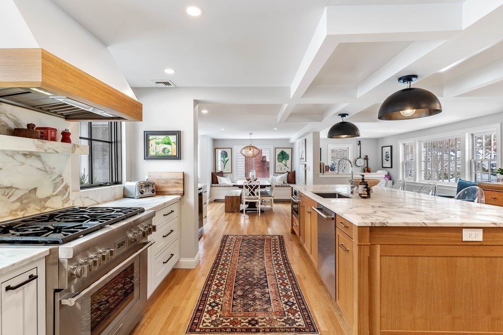 91 Valley Road Milton, MA 02186 - Photo 9 of 29 a kitchen with stainless steel appliances granite countertop a stove and a sink