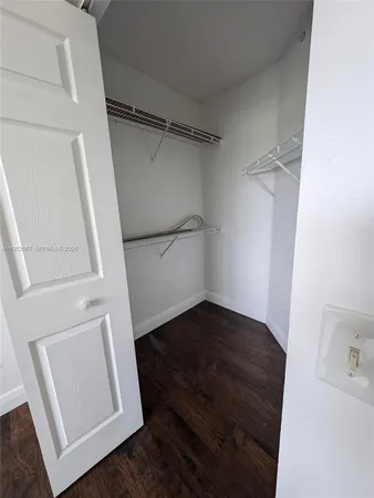 a view of an empty walk in closet