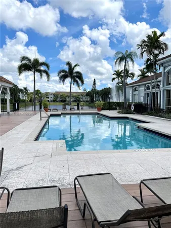 a view of a swimming pool with a patio