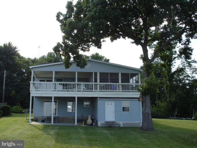 1117 Engleberth Road Essex, MD 21221 - Photo 11 of 20 a front view of a house with a garden