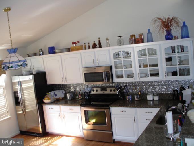 1117 Engleberth Road Essex, MD 21221 - Photo 13 of 20 a kitchen with a sink and a stove top oven