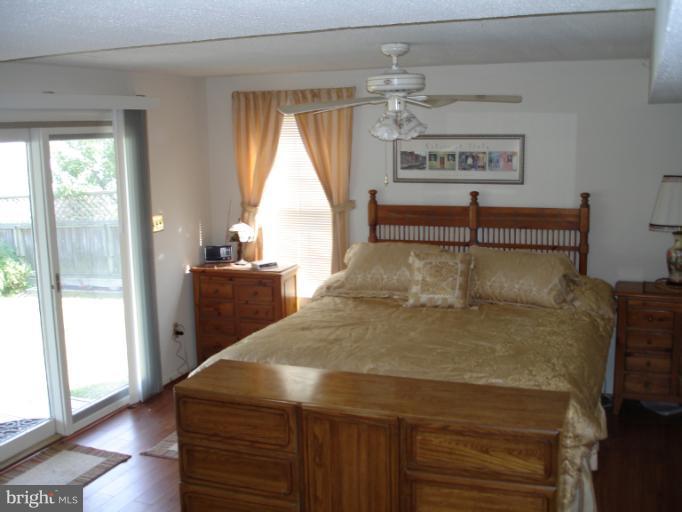 1117 Engleberth Road Essex, MD 21221 - Photo 4 of 20 a bed sitting in a room next to a window