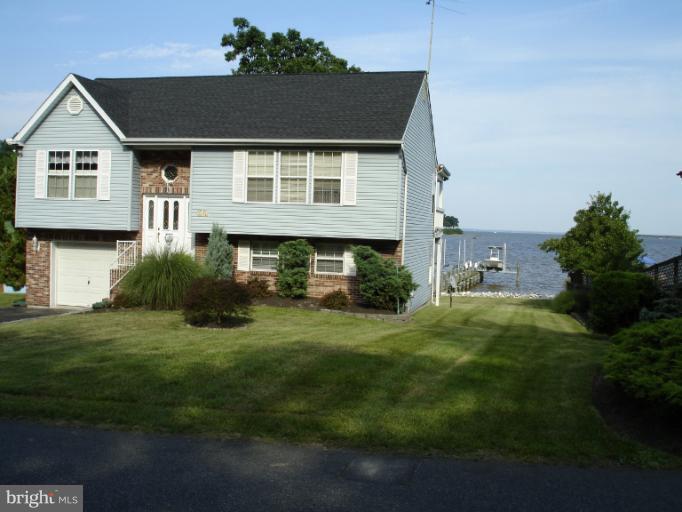 1117 Engleberth Road Essex, MD 21221 - Photo 8 of 20 a front view of a house with a yard