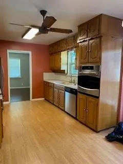a kitchen with stainless steel appliances a stove and a refrigerator