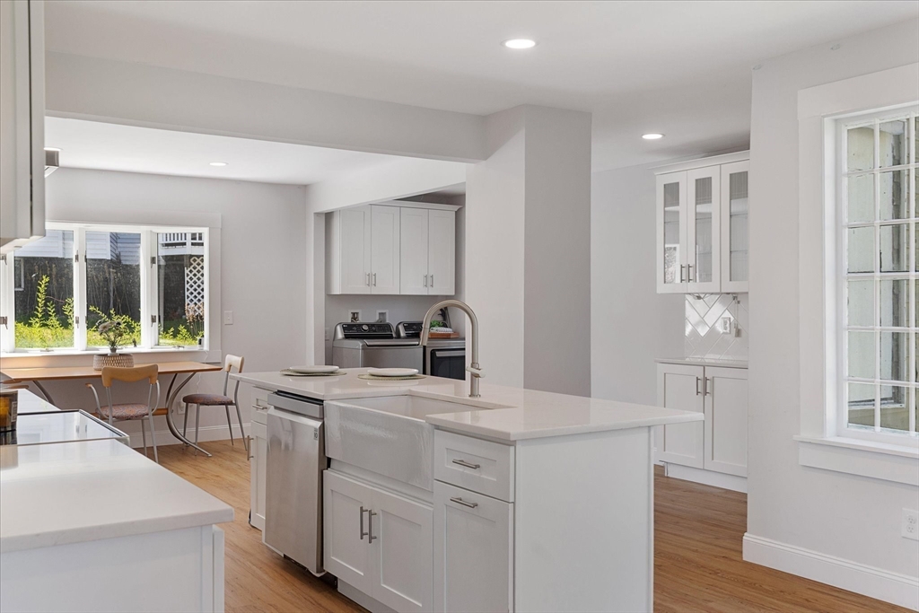 4 Chamberlain Parkway Worcester, MA 01602 - Photo 11 of 42 a kitchen with white cabinets and window