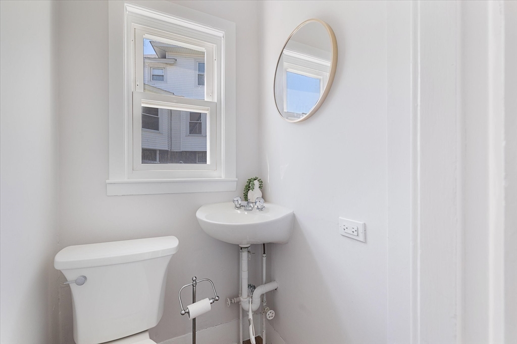 4 Chamberlain Parkway Worcester, MA 01602 - Photo 19 of 42 a bathroom with a sink a mirror and a toilet