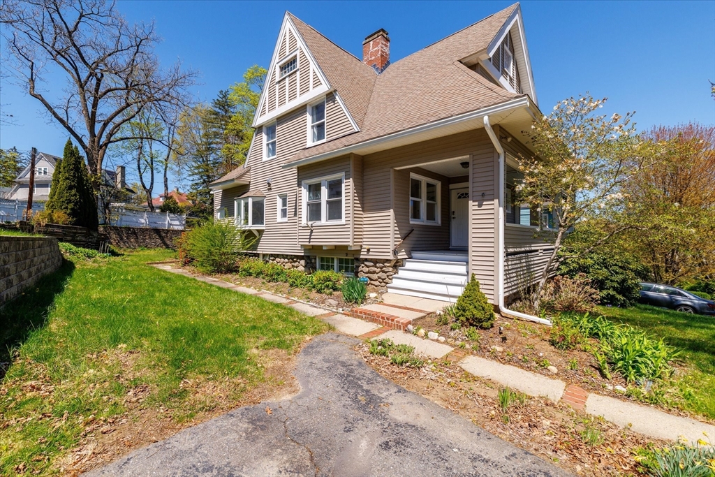 4 Chamberlain Parkway Worcester, MA 01602 - Photo 2 of 42 a front view of a house with garden