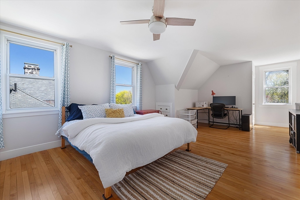 4 Chamberlain Parkway Worcester, MA 01602 - Photo 23 of 42 a bedroom with a bed and wooden floor