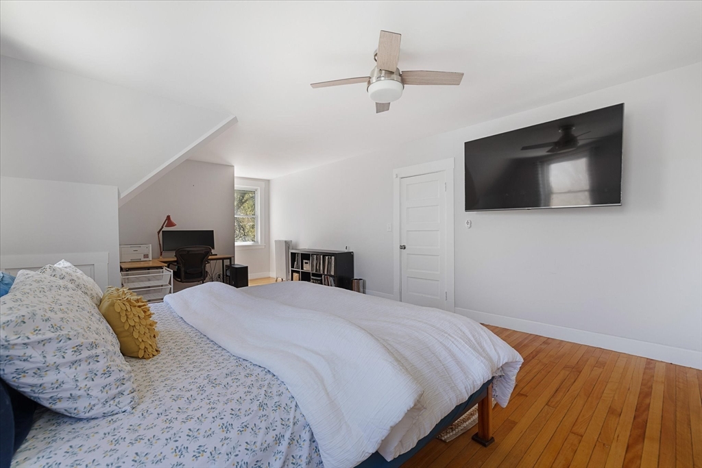 4 Chamberlain Parkway Worcester, MA 01602 - Photo 24 of 42 a bedroom with a bed and flat screen tv