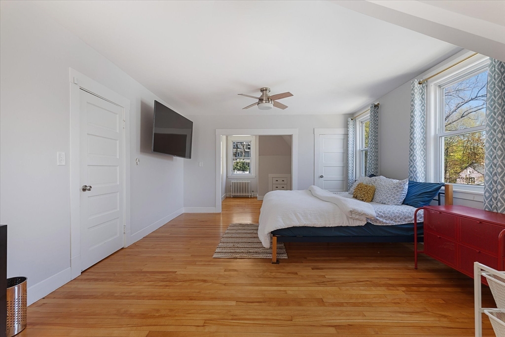 4 Chamberlain Parkway Worcester, MA 01602 - Photo 25 of 42 a spacious bedroom with a bed and a flat screen tv