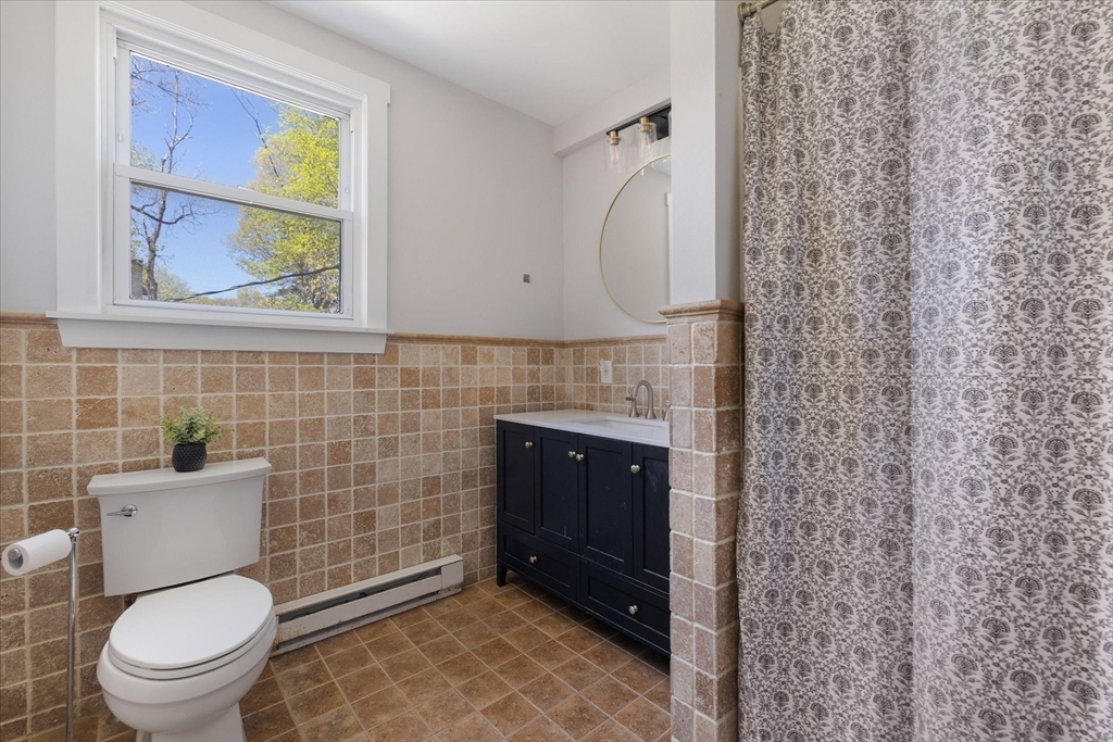 4 Chamberlain Parkway Worcester, MA 01602 - Photo 30 of 42 a bathroom with a toilet a sink and mirror