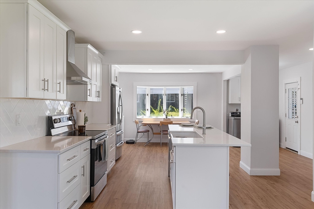 4 Chamberlain Parkway Worcester, MA 01602 - Photo 9 of 42 a kitchen with sink stove and cabinets