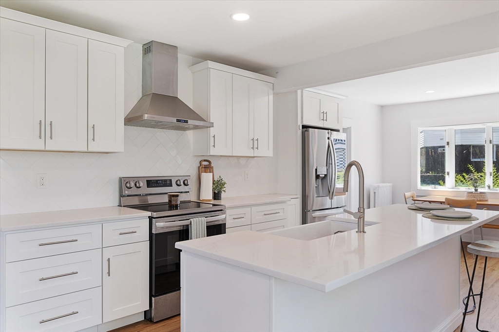 4 Chamberlain Parkway Worcester, MA 01602 - Photo 10 of 42 a kitchen with white cabinets stainless steel appliances and sink