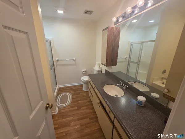 a bathroom with a sink double vanity and a mirror
