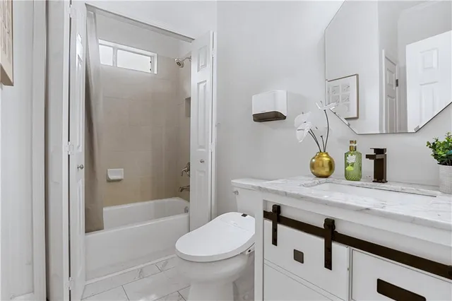 a bathroom with a sink and a window